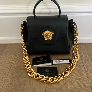 Versace Gold top handle black bag. Virtually brand new!